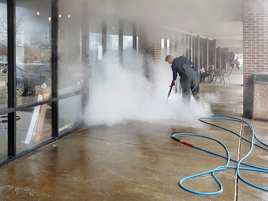 Commercial building, parking lots and dumpster corral power washing company in Olathe Kansas