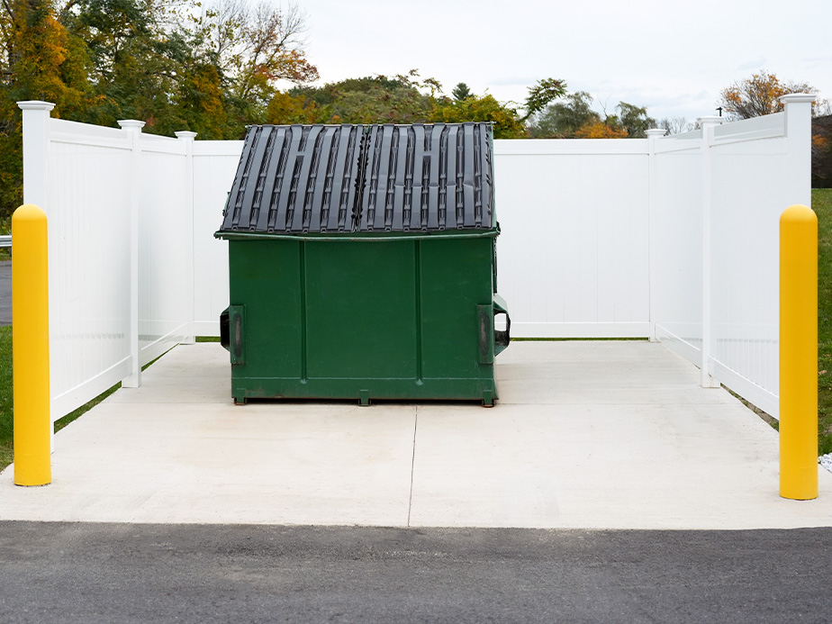 Power washing dumpster enclosures for commercial businesses in Olathe Kansas