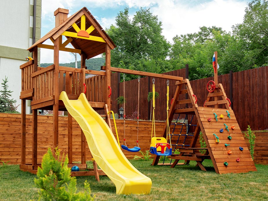 Staining and restoring wooden playgrounds in Olathe Kansas